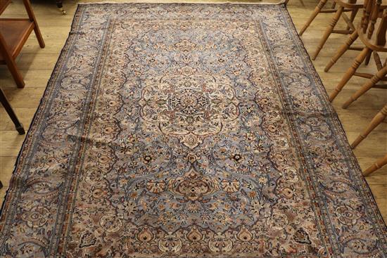 A Persian pale blue silky carpet, 262 cm x 193 cm